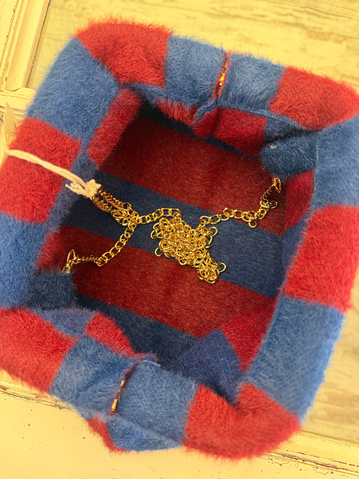 POCHETTE PELUCHE A RIGHE BORDEAUX E BLU